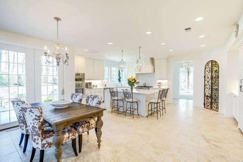 Country themed kitchen remodel with wine room and chandeliers