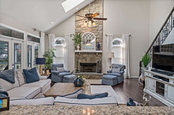 Bright living room with stone fireplace in Centreville