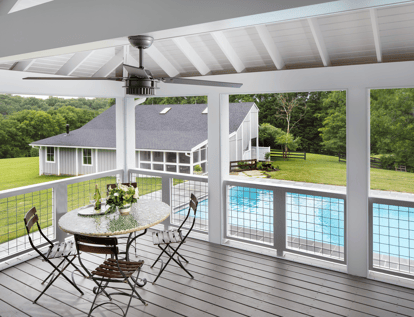 Covered white deck overlooking pool in Great Falls