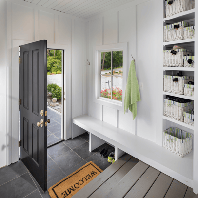 White panel mudroom shiplap with grey tile floors