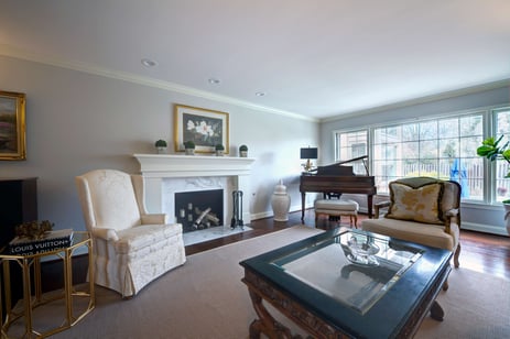 Living room fireplace with large panel windows